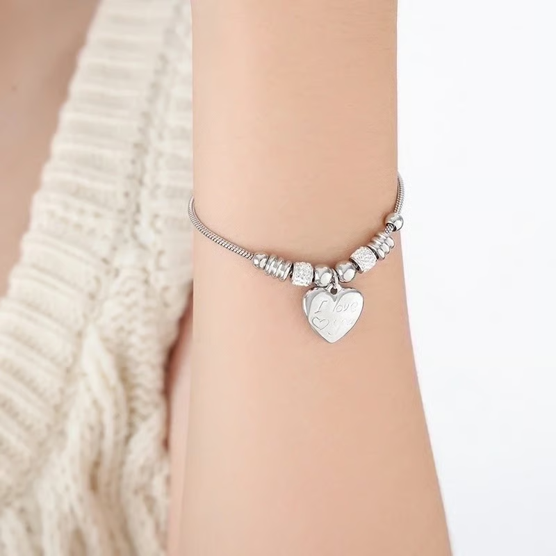 506 / Edelstahl Zurarmband Charms mit Herzanhänger silberfarbig